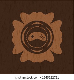 video game icon inside retro style wooden emblem