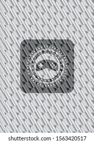 video game icon inside shiny silver emblem. Scales pattern. Vector Illustration. Detailed.