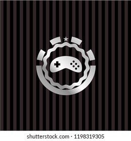 video game icon inside silver badge