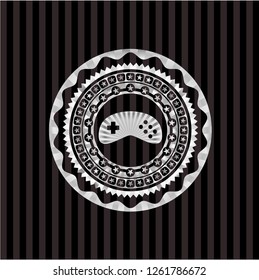 video game icon inside silver shiny badge