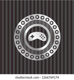 video game icon inside silver shiny emblem