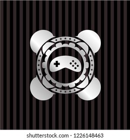 video game icon inside silvery emblem or badge