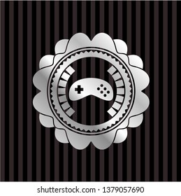 video game icon inside silvery emblem or badge