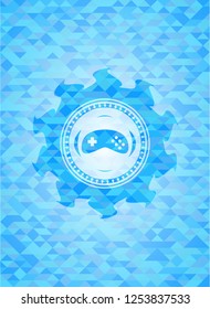 video game icon inside sky blue emblem with triangle mosaic background