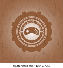 video game icon inside vintage wood emblem