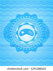 video game icon inside water representation emblem.