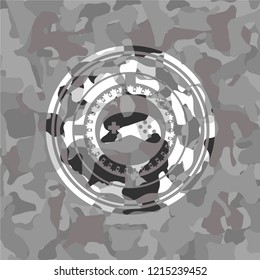 video game icon on grey camo texture
