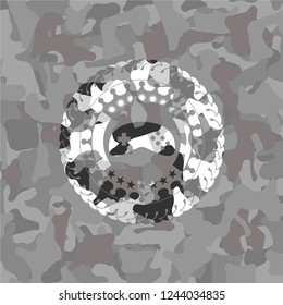 video game icon on grey camo texture