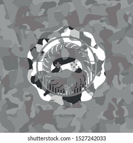 video game icon on grey camouflaged texture