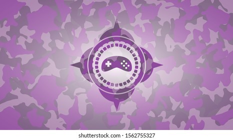video game icon on pink camouflaged pattern