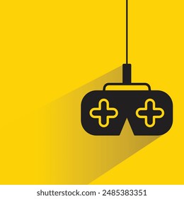 video game joystick with shadow on yellow background