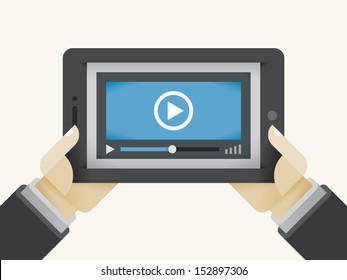 Video movie player on tablet computer in holding human hands. Concepts: streaming technologies, services (Youtube, Netflix), home films media collection, video sharing (Instagram, Facebook), online TV