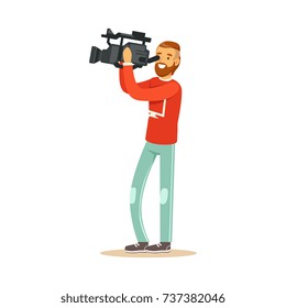Video operator looking through camcorder