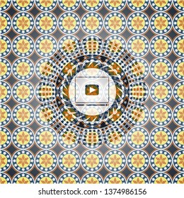 video player icon inside arabic badge. Arabesque decoration.