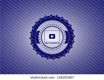 video player icon inside badge with jean texture
