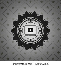 video player icon inside black emblem