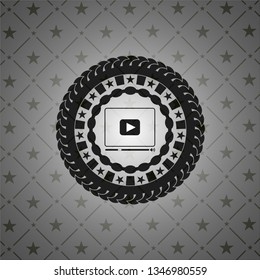 video player icon inside black emblem