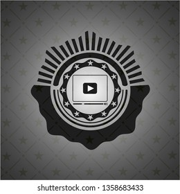video player icon inside black badge