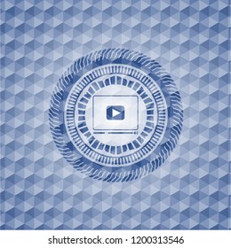 video player icon inside blue emblem or badge with abstract geometric polygonal pattern background.