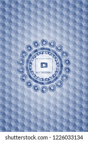 video player icon inside blue hexagon badge.