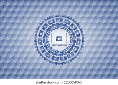 video player icon inside blue hexagon emblem.