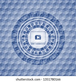 video player icon inside blue polygonal emblem.