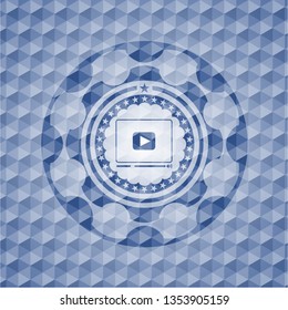 video player icon inside blue emblem or badge with abstract geometric polygonal pattern background.
