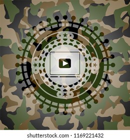 video player icon inside camouflage texture