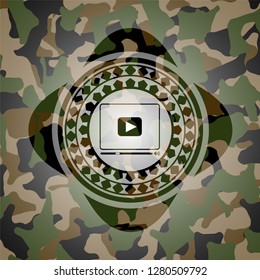 video player icon inside camouflage texture