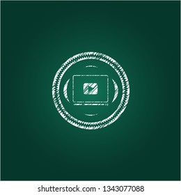 video player icon inside chalkboard emblem written on a blackboard