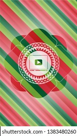 video player icon inside christmas emblem background.
