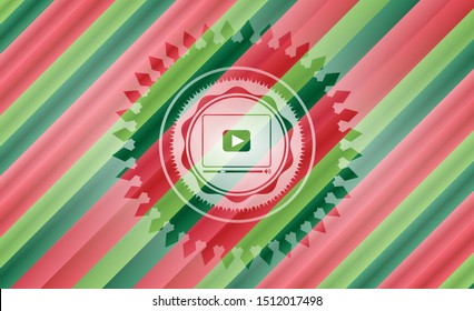 video player icon inside christmas style badge..