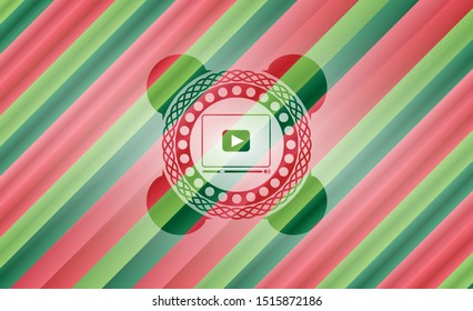 video player icon inside christmas emblem.