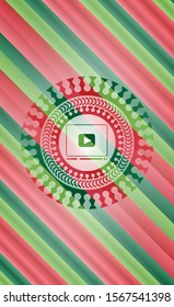 video player icon inside christmas style badge..
