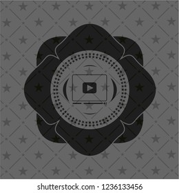 video player icon inside dark emblem. Retro