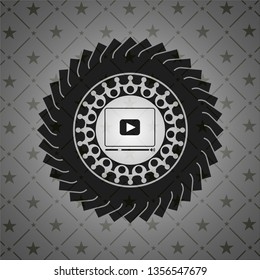 video player icon inside dark emblem