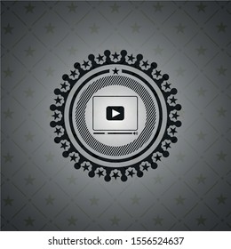 video player icon inside dark badge or emblem
