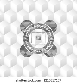 video player icon inside grey emblem with geometric cube white background