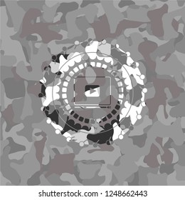 video player icon inside grey camo emblem
