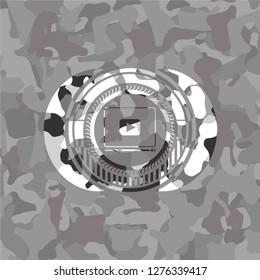 video player icon inside grey camo emblem