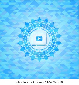 video player icon inside light blue emblem with triangle mosaic background