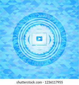 video player icon inside light blue mosaic emblem