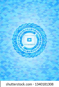 video player icon inside light blue mosaic emblem