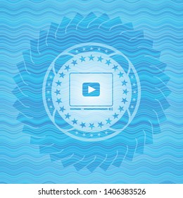 video player icon inside light blue water emblem background.
