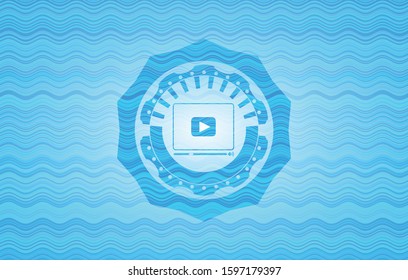 video player icon inside light blue water emblem.