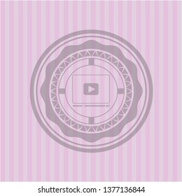 video player icon inside pink emblem. Retro