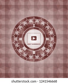 video player icon inside red geometric pattern emblem. Seamless.