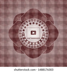 video player icon inside red emblem with geometric pattern background. Seamless.