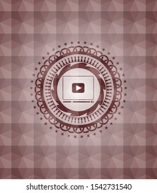 video player icon inside red seamless polygonal badge.