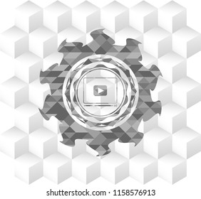 video player icon inside retro style grey emblem with geometric cube white background